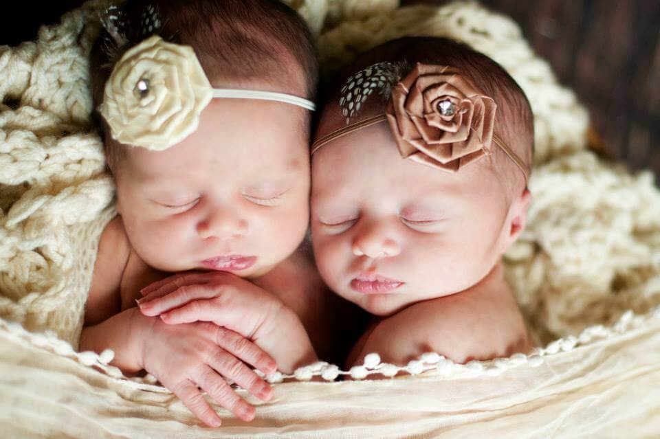 A Close-Up Shot of the Faces of the Twins While They Sleep in a Rocker with Blankets