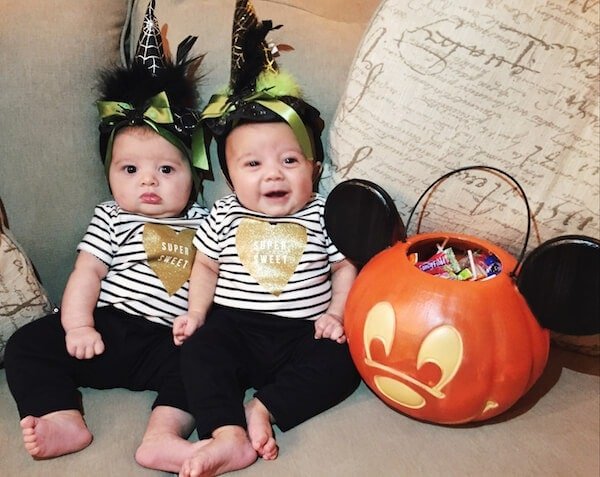 Twin girls first halloween in black and white outfits