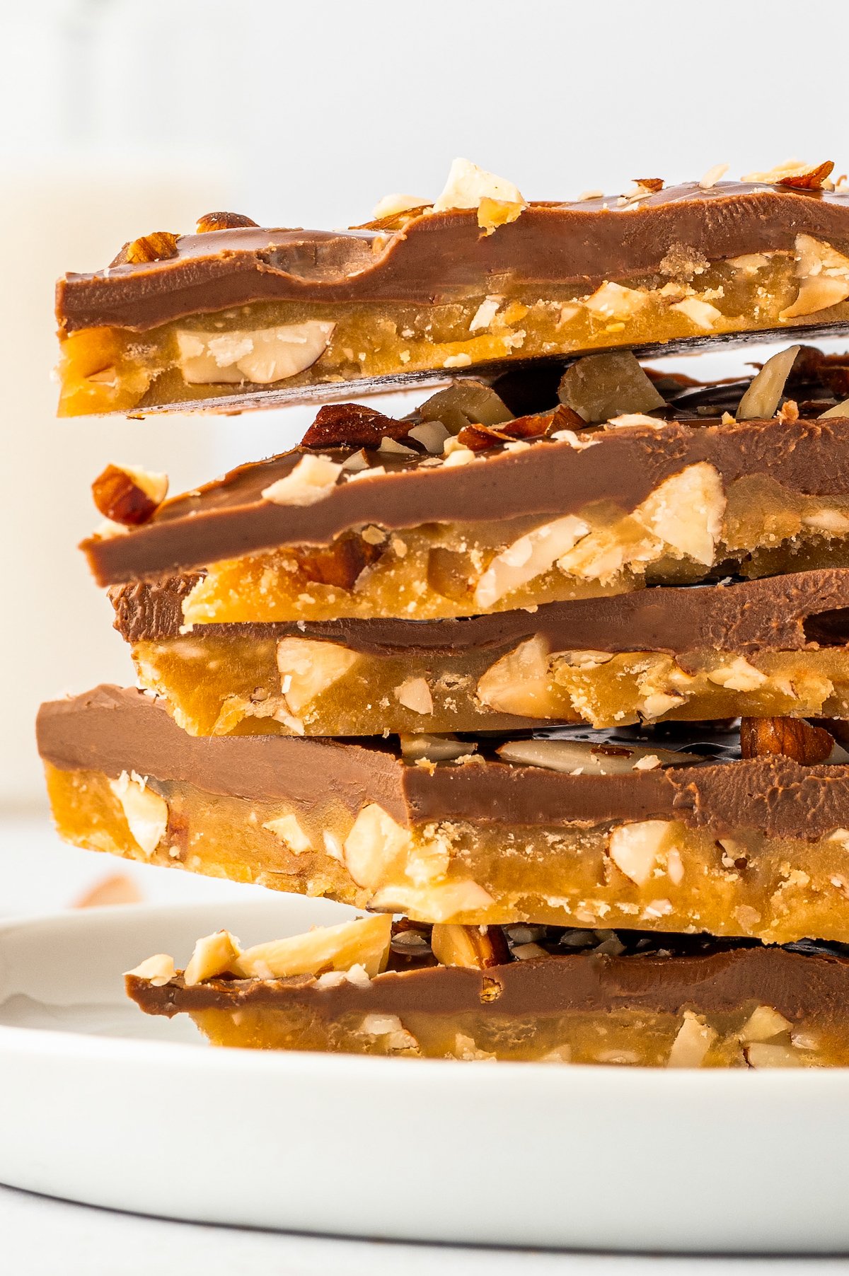 Side view of a stack of Almond Roca bark pieces, to show the layers and textures.