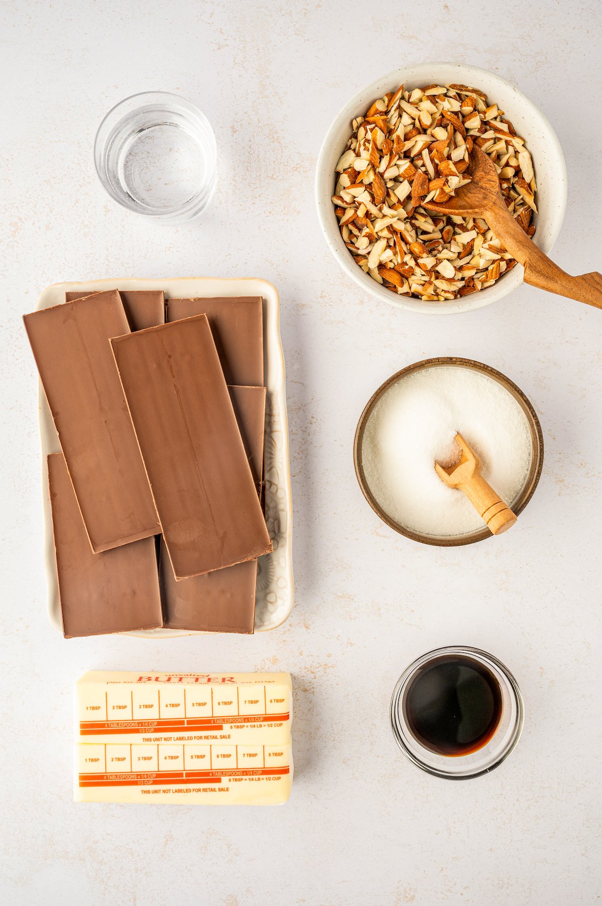 Ingredients for Almond Roca bark arranged on a table.