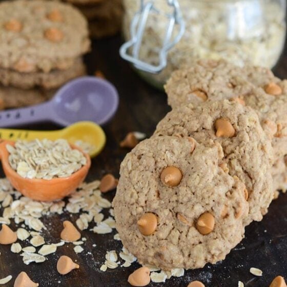 Oatmeal Scotchies with butterscotch chips and measuring spoons with oats