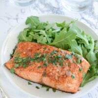 Balsamic Roasted Salmon on a white plate with a fork