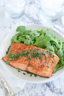 Balsamic Roasted Salmon on a white plate with a fork