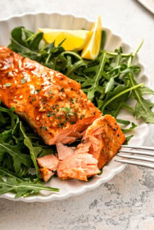 Digging into some flaky, balsamic salmon with an arugula salad on the side.
