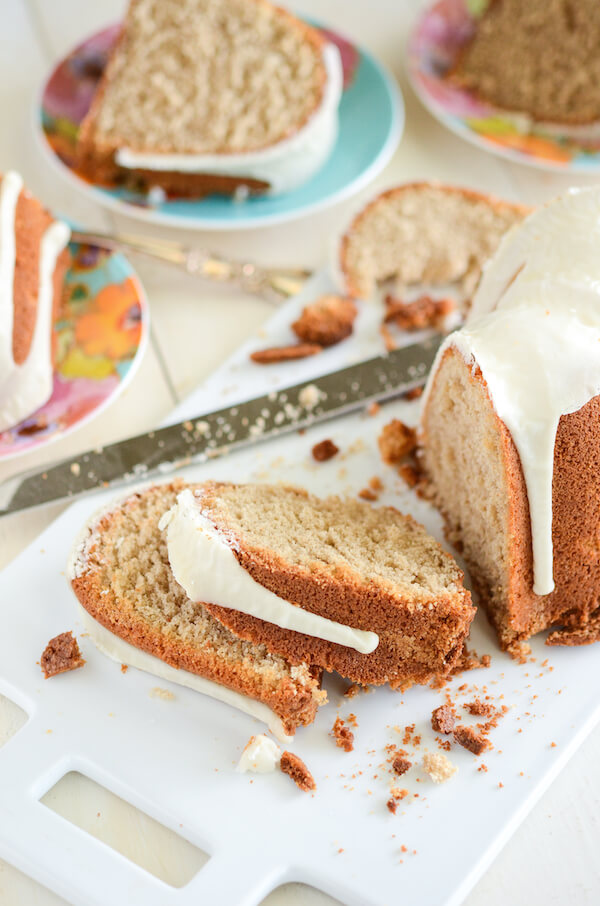 Sliced Spiced Buttermilk Pound Cake on white cutting board