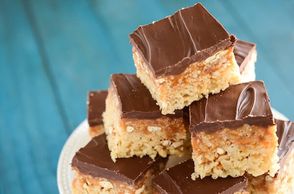 Stack of Turtle Rice Krispies Treats on a white cake stand