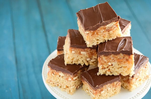 Stacks of Turtle Rice Krispies Treats on a white stand