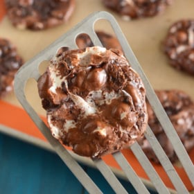 Close up of Flourless Chocolate Fudge Marshmallow Cookies on a spatula