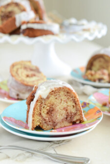 Slices Honey Bun Cake on colorful plates with forks