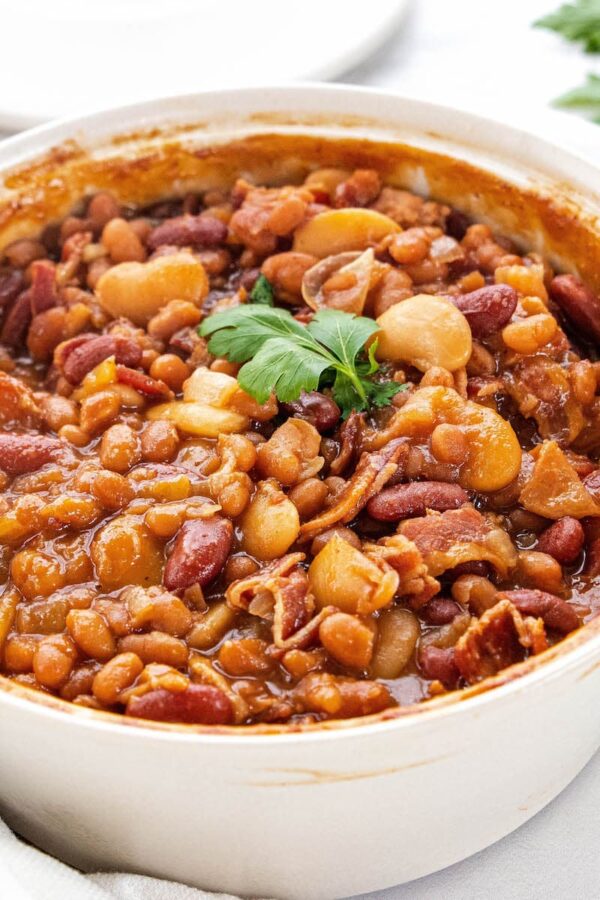 Large white bowl of baked beans.