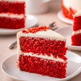 A slice of red velvet cake on a plate.