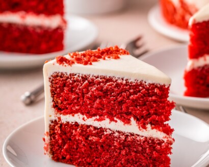 A slice of red velvet cake on a plate.