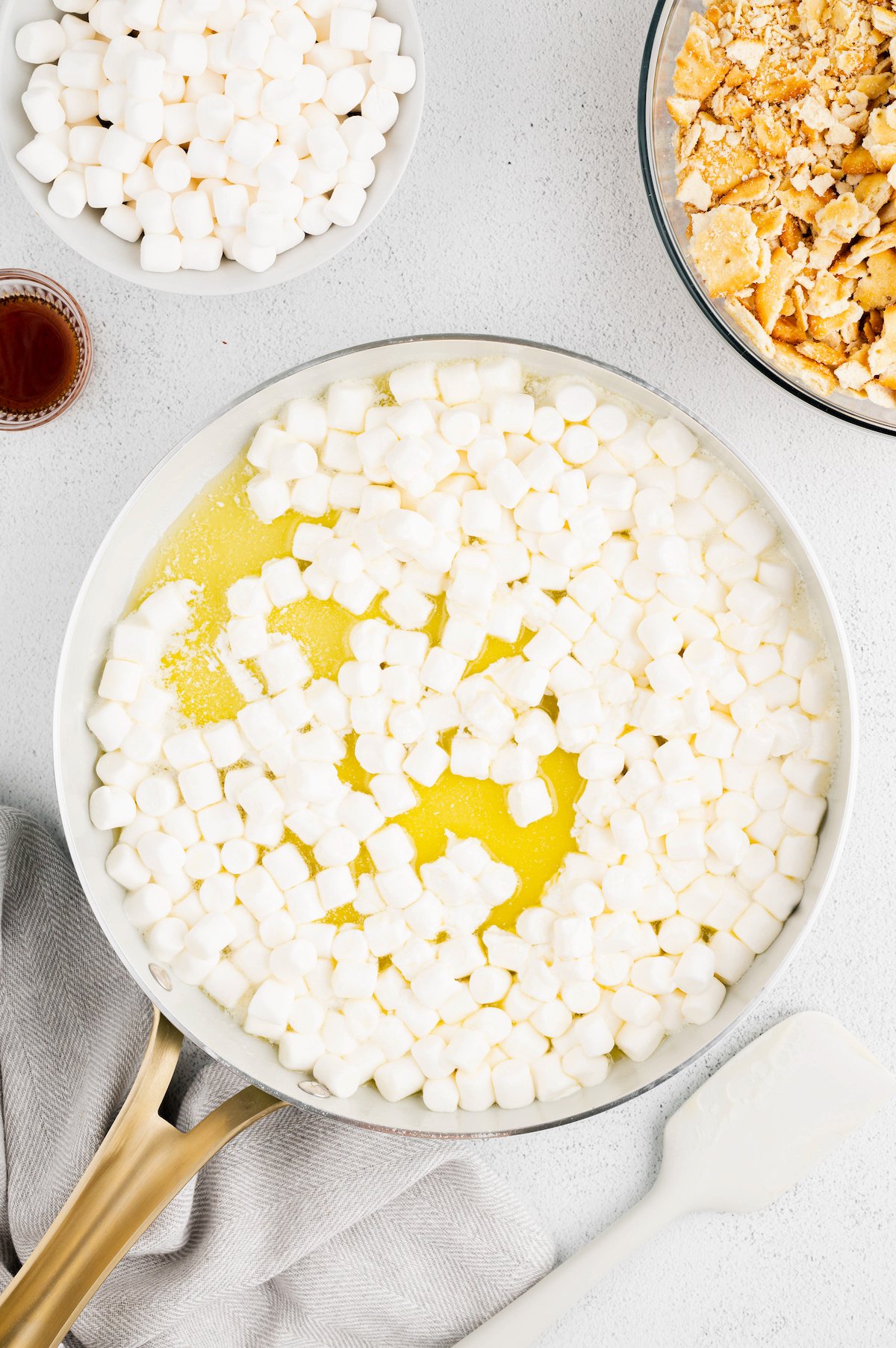 Marshmallows being melted in skillet with butter.