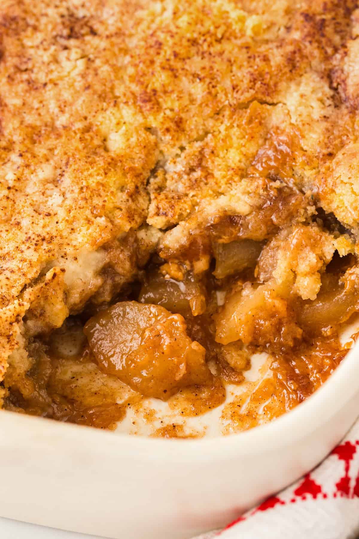 Gooey caramel apple dump cake in a baking dish.