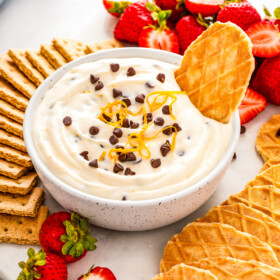 Cannoli dip with chocolate chips and wafer cookies.