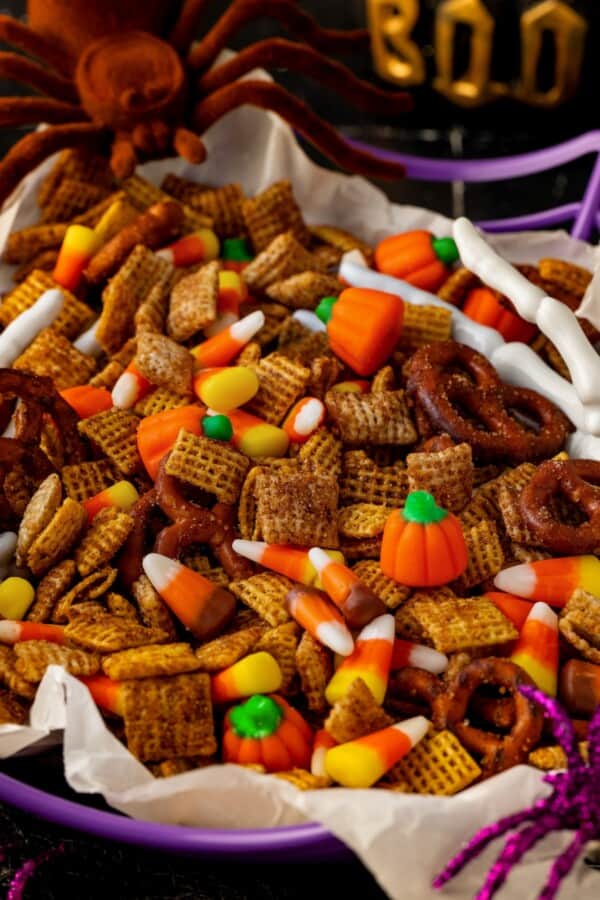 Halloween chex mix is speckled with harvest mix candy corn.