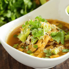 Slow Cooker Chicken Tortilla Soup in a white bowl