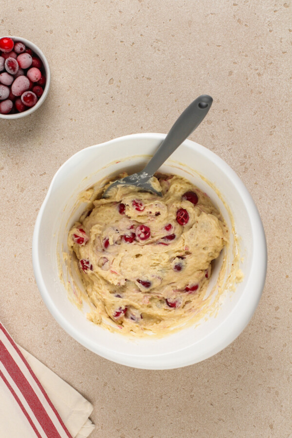Folding the cranberries into the muffin batter. 