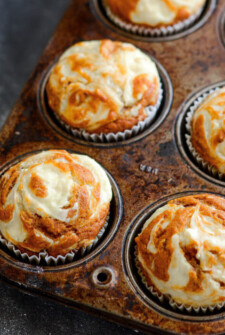 Pumpkin Cream Cheese Swirl Muffins: my favorite pumpkin muffins ever. You start with a moist spiced pumpkin muffin and top it with swirls of sweet cream cheese that melt into the top as it bakes. Bonus? They only take 30 minutes to make!