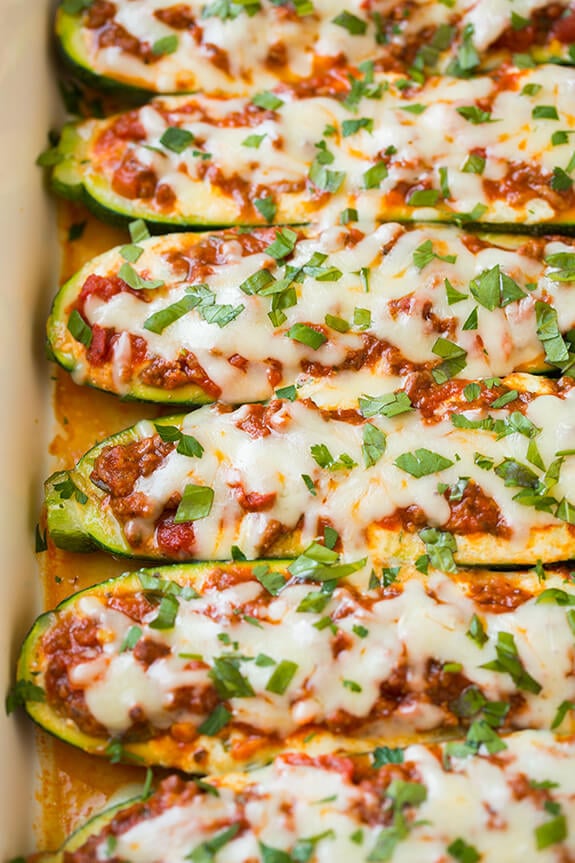 Lasagna Zucchini Boats Topped with Cheese and Fresh Herbs