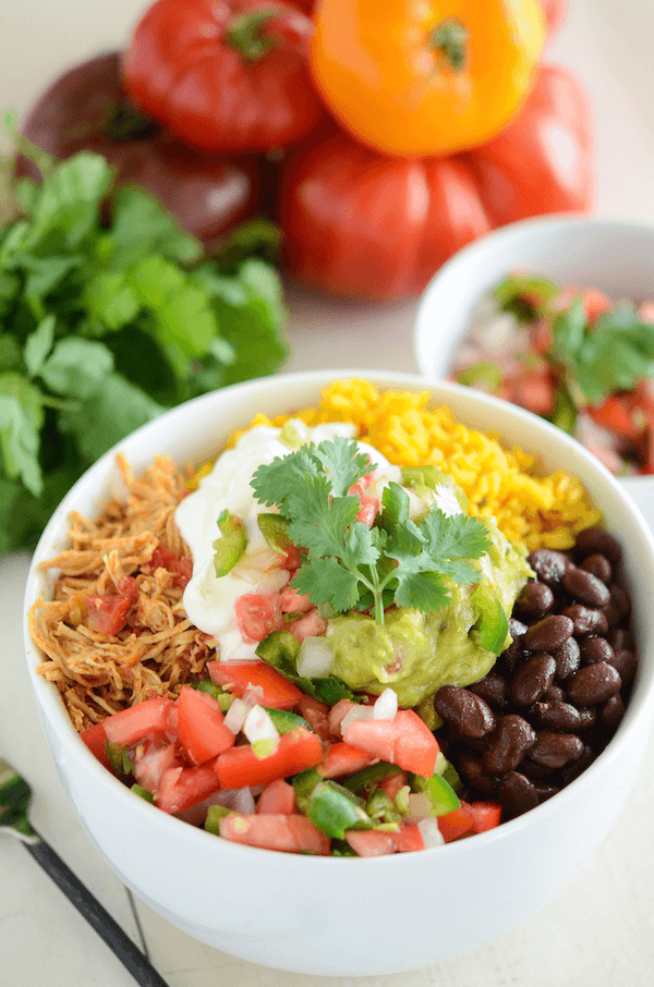 A Salsa Chicken Bowl Topped with Sour Cream and Guacamole