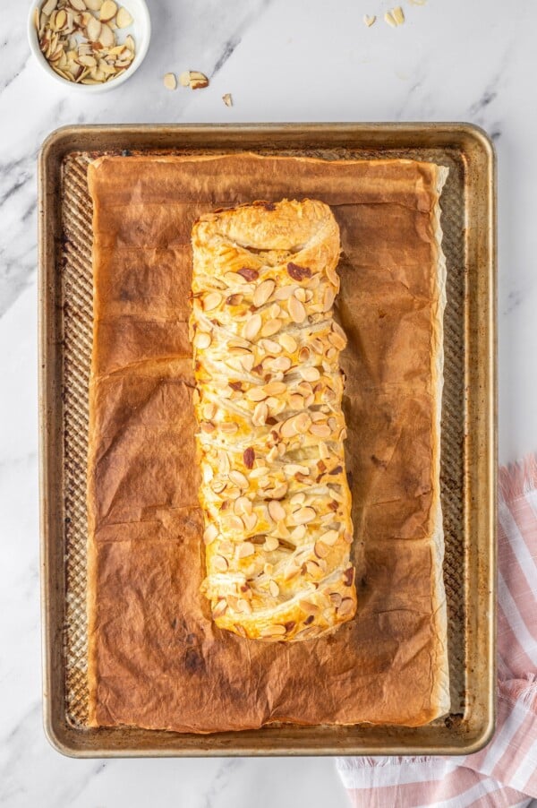 Baked almond pastry on a baking sheet.