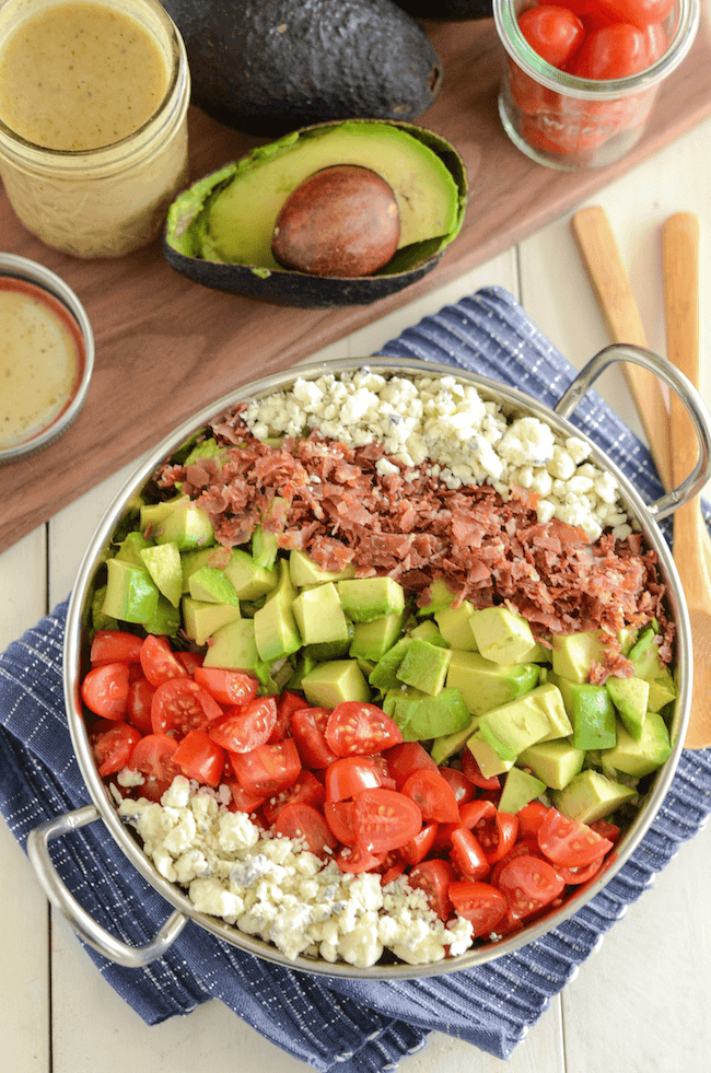 Copycat Maggiano's Chopped Salad Recipe! Crispy pancetta, avocado, tomatoes, blue cheese (or gorgonzola) and a delicious homemade dressing!