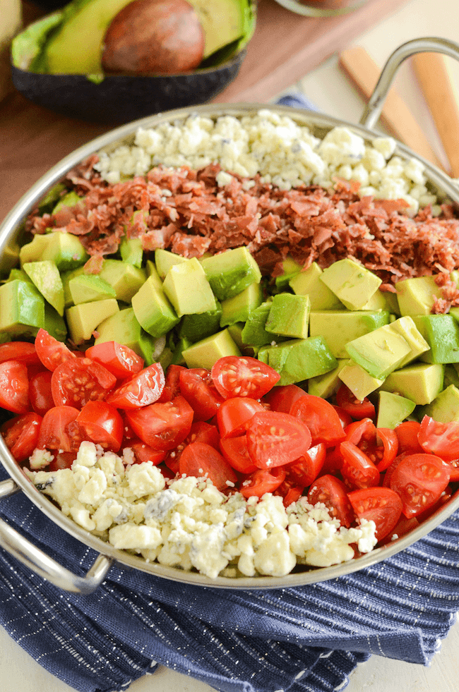 Copycat Maggiano's Chopped Salad Recipe! Crispy pancetta, avocado, tomatoes, blue cheese (or gorgonzola) and a delicious homemade dressing!