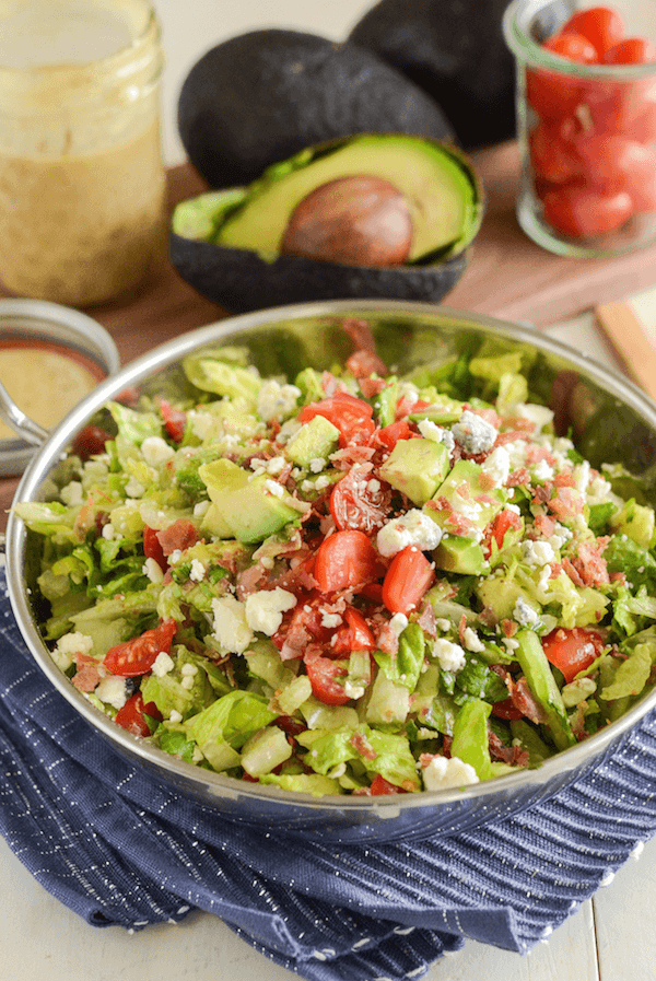 Copycat Maggiano's Chopped Salad Recipe! Crispy pancetta, avocado, tomatoes, blue cheese (or gorgonzola) and a delicious homemade dressing!