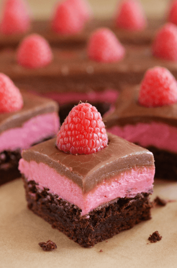 Raspberry Chocolate Bars! Layer of delicious brownie, raspberry cream and easy chocolate ganache!