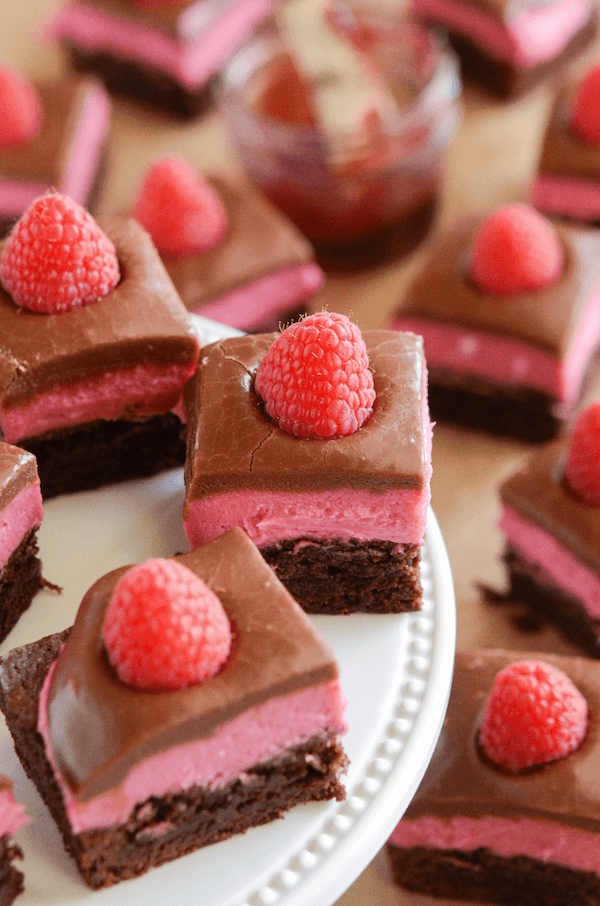Raspberry Chocolate Bars! Layer of delicious brownie, raspberry cream and easy chocolate ganache!