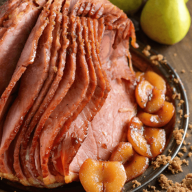 Pear Glazed Ham on a serving platter with fresh pears