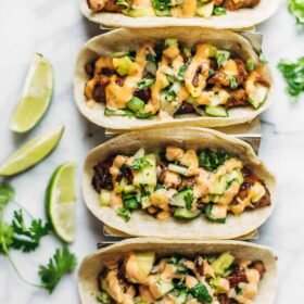 Caramelized Pork Tacos with Pineapple Salsa and Slices of Lime