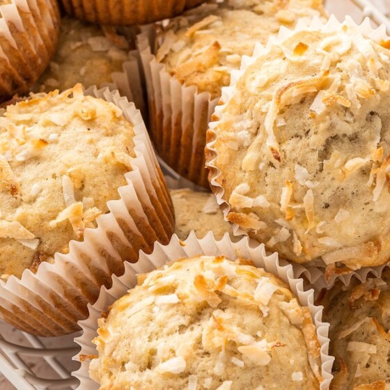 Landscape photo of breakfast banana muffins with toasted coconut.