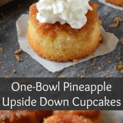 Pineapple Upside Down Cupcakes topped with whipped cream and a cherry