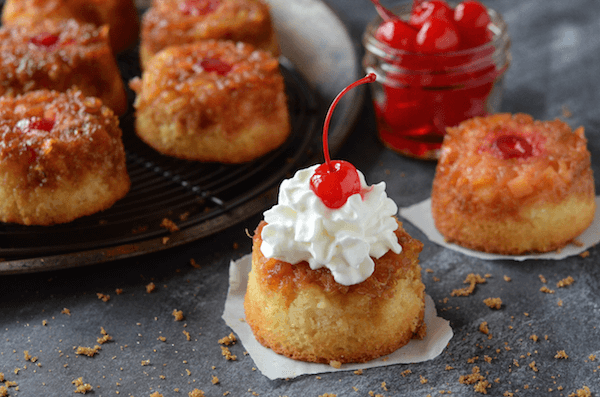 These One-Bowl Pineapple Upside Down Cupcakes are just like the classic version -- a sweet dense cake with a brown sugar caramelized pineapple topping!