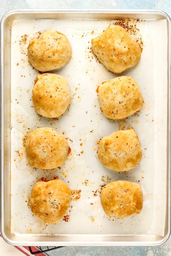 Meatball bombs are on a baking sheet.