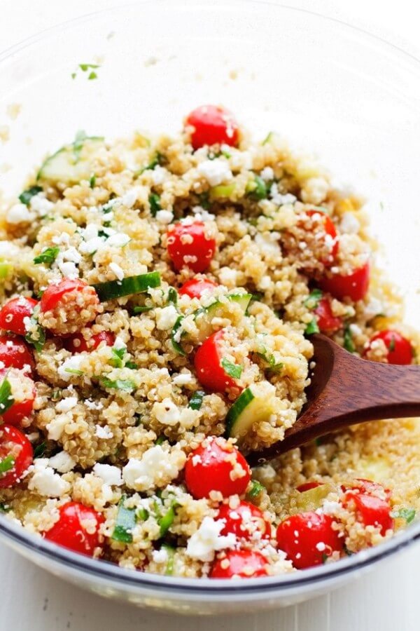 A Summer Tomato and Cucumber Quinoa Salad in a Clear Salad Bowl