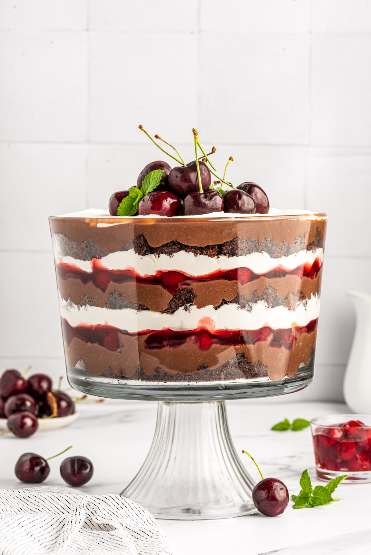 A finished Black Forest trifle from the side, showing layers.