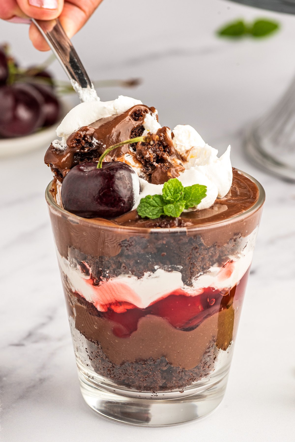 A single serving of black forest layered dessert.