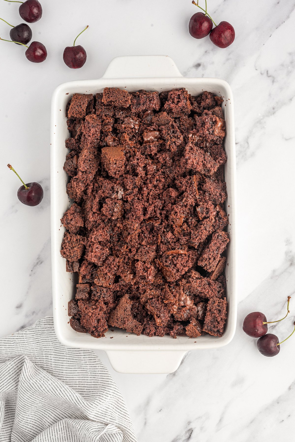 Cake crumbled into small pieces in a dish.