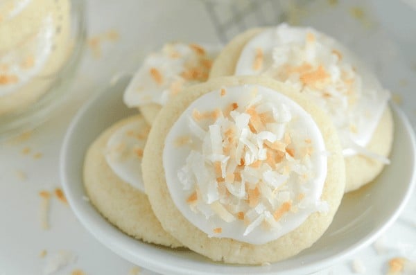 Coconut Meltaway Cookies - a soft coconut shortbread cookie topped with royal icing and toasted coconut! 