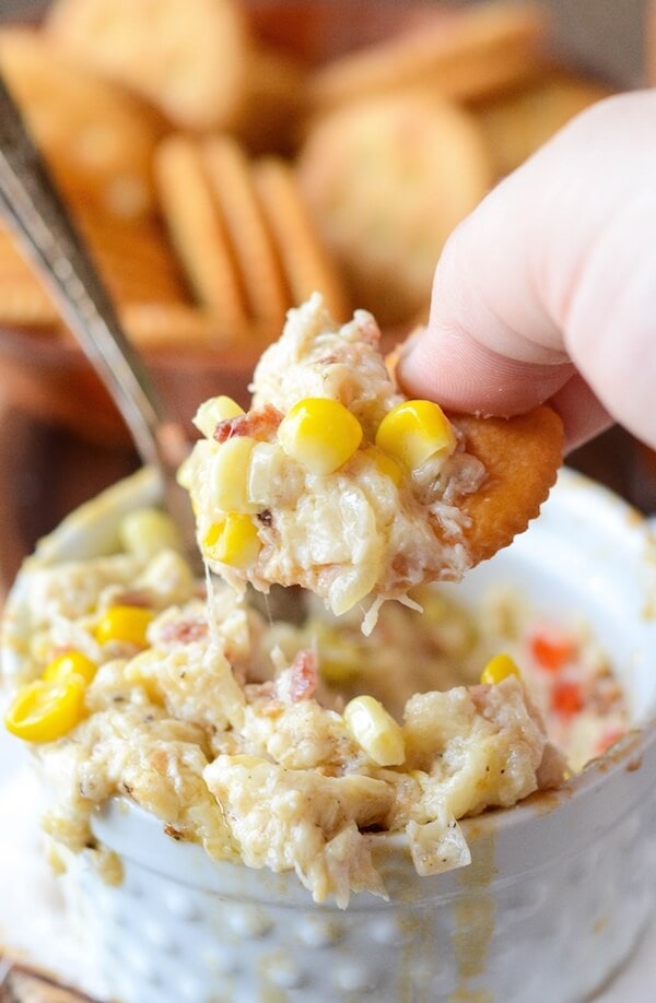 Hot Crab, Corn and Bacon Dip! Baked creamy crab dip filled with cheese, corn, bacon and jalapeños!