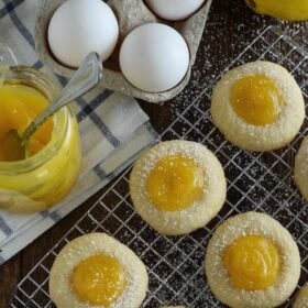 Lemon Curd Shortbread Cookies Dusted with Powdered Sugar on a Wire Rack