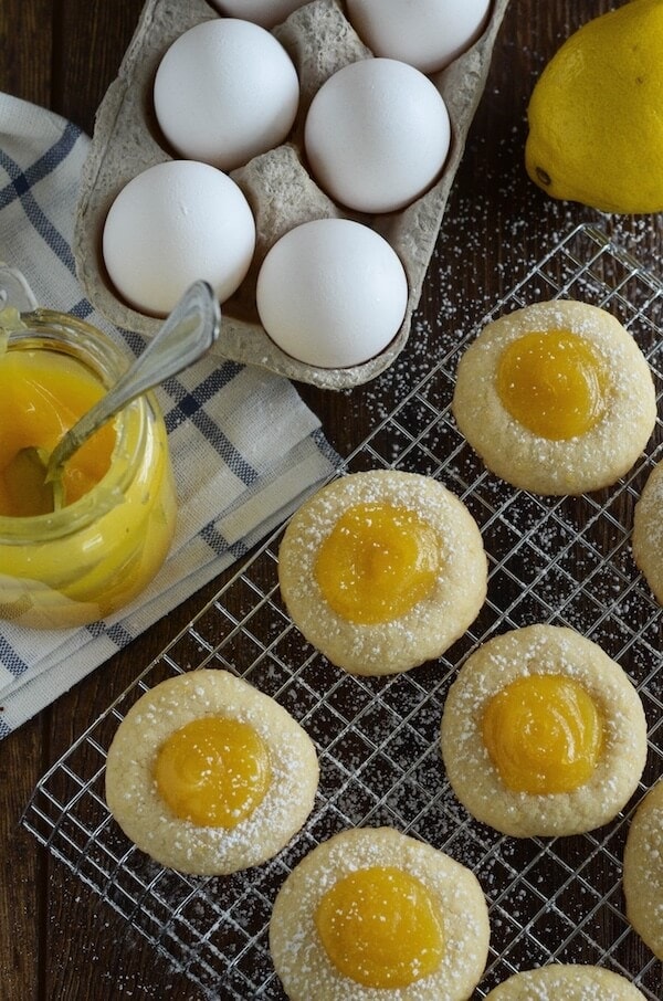 Lemon Curd Shortbread Cookies Dusted with Powdered Sugar on a Wire Rack