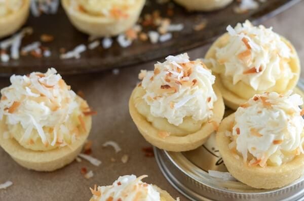 Coconut Cream Pie Cookie Cups - the perfect bite size combination of two classic desserts — coconut cream pie and sugar cookies!