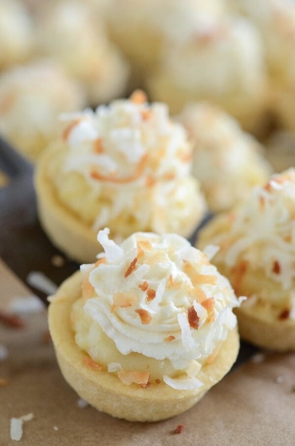 Coconut Cream Pie Cookie Cups - the perfect bite size combination of two classic desserts — coconut cream pie and sugar cookies!