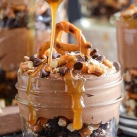 This chocolate trifle recipe is filled with gooey caramel, crunchy pretzels, and whipped chocolate and peanut butter cream cheese filling.