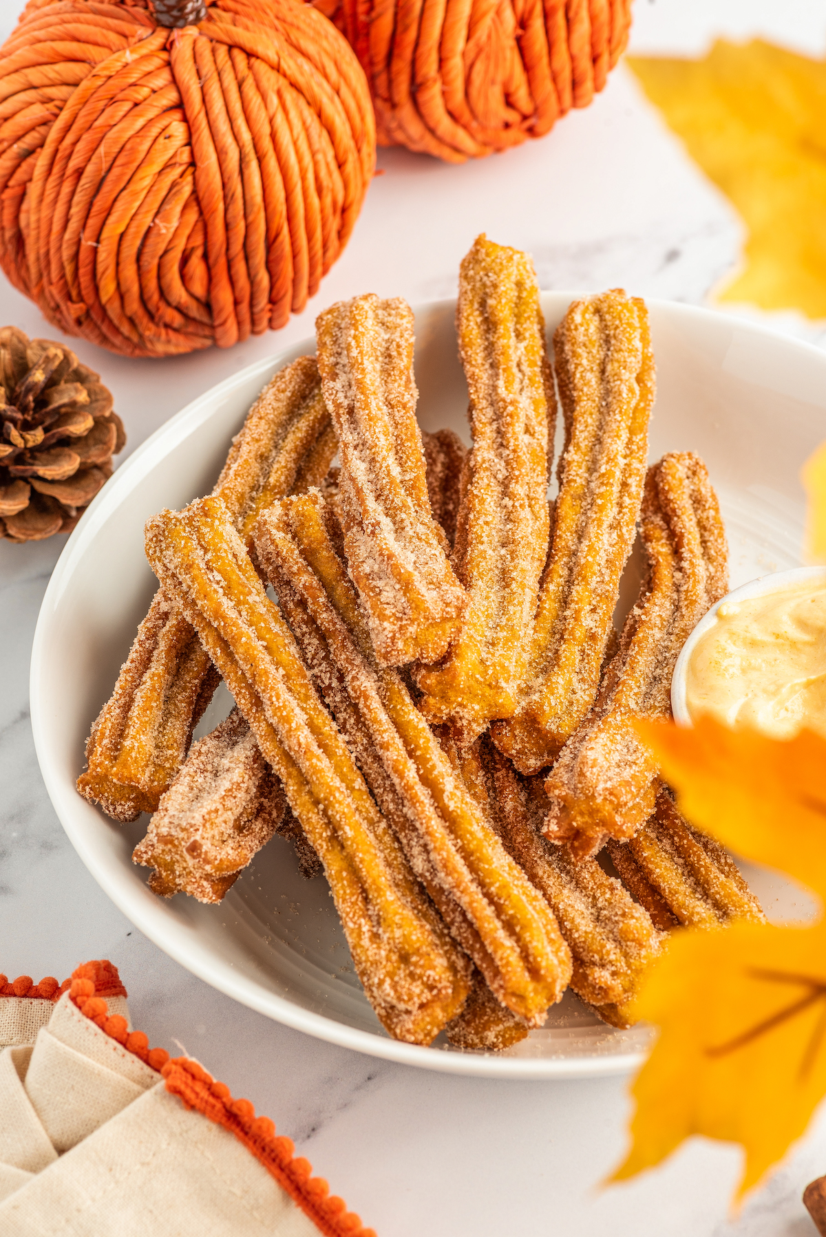 Pumpkin churros on a plate.