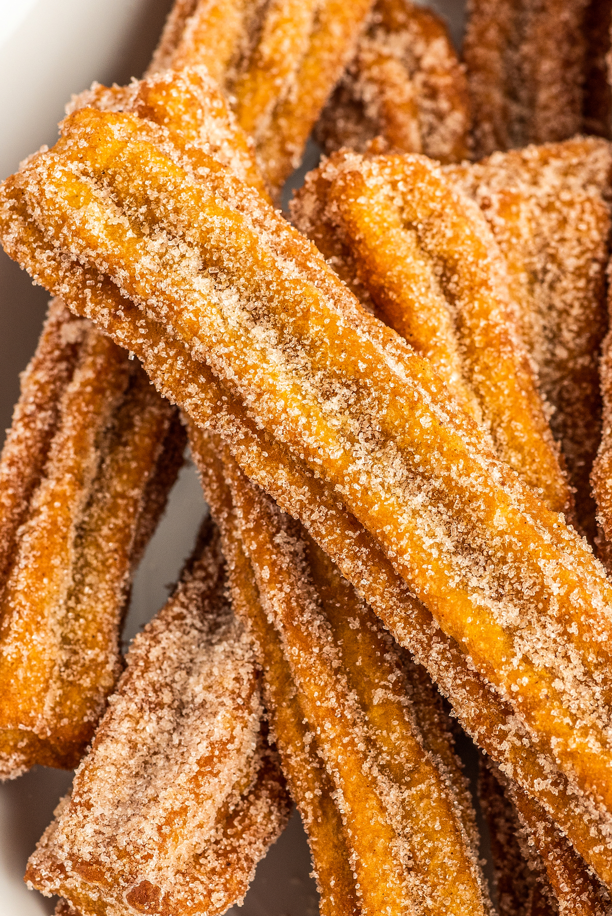 Close-up photo of pumpkin churros with cinnamon sugar. 